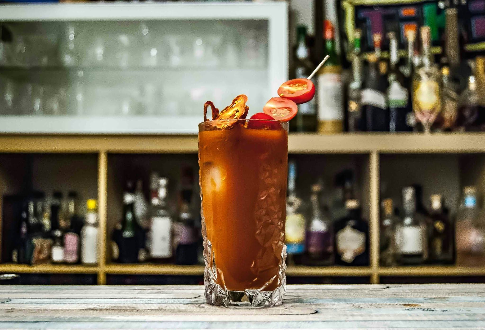 Virgin Bloody Maria with tomato garnish in a tall crystal glass
